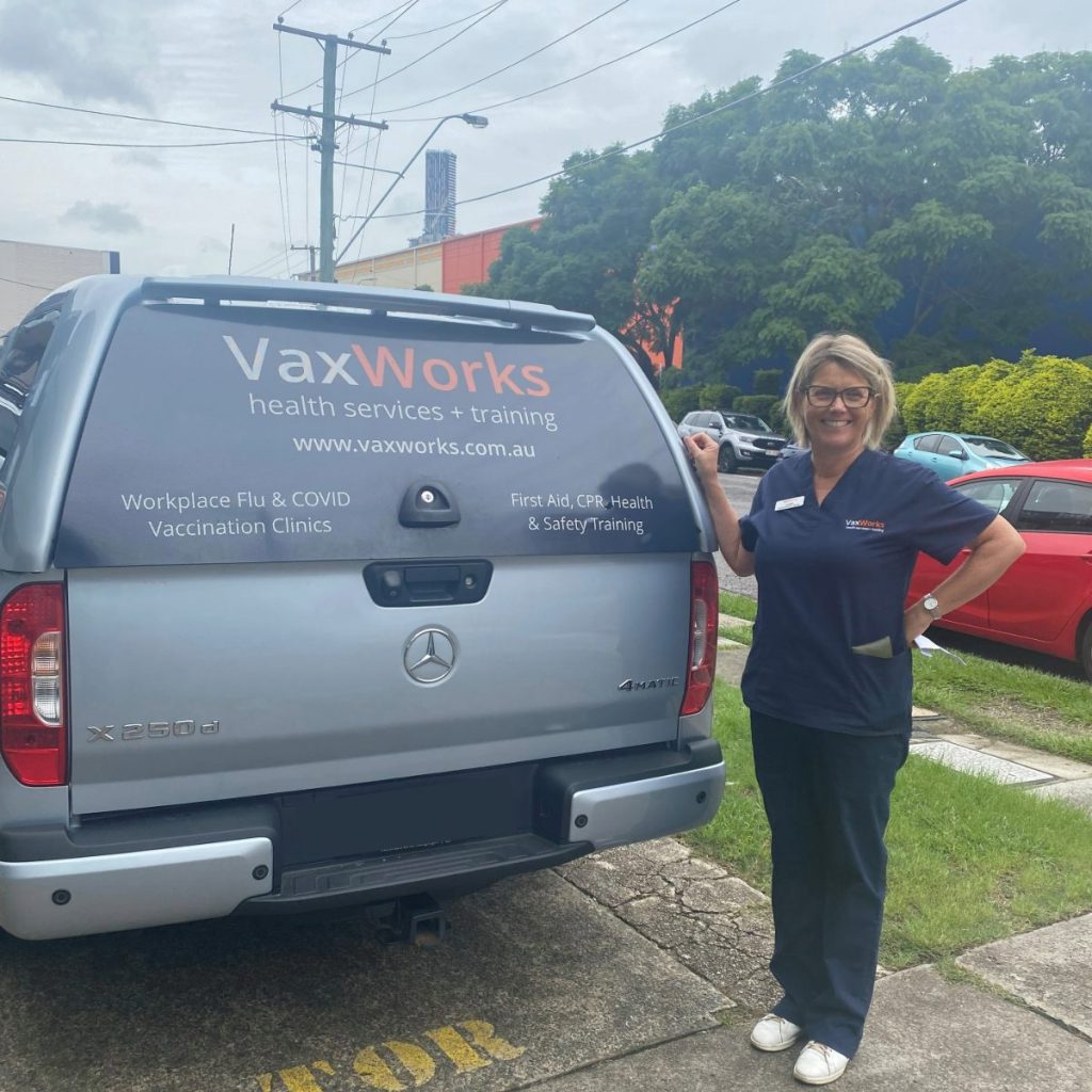 Our immunisation nurse, Lou, ready to head out to a vaccination clinic next to the VaxWorks van.